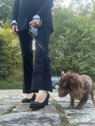 Ann in her front yard in navy velveteen trousers, a matching blazer, and the Bridgette heel.